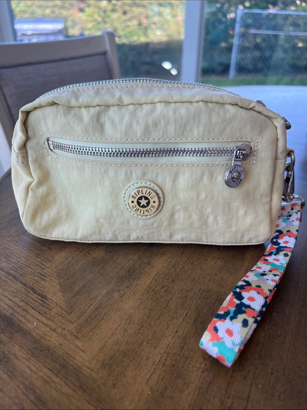 Kipling Pale Yellow Nylon Wristlet with Floral Strap